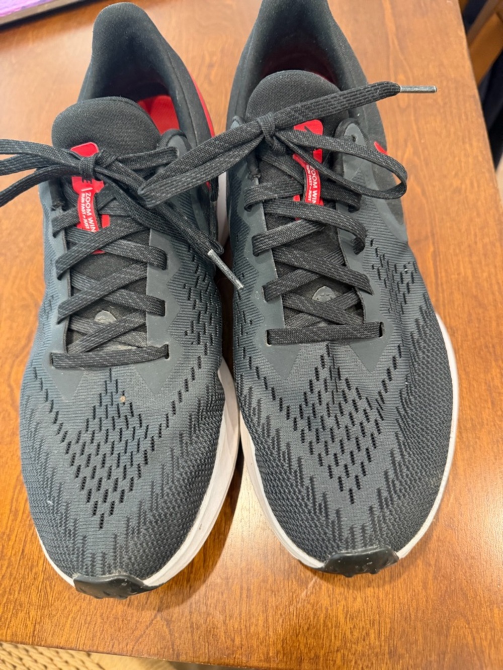 Men’s Nike Black Running Shoe with Red Insole Graphic. Light wear